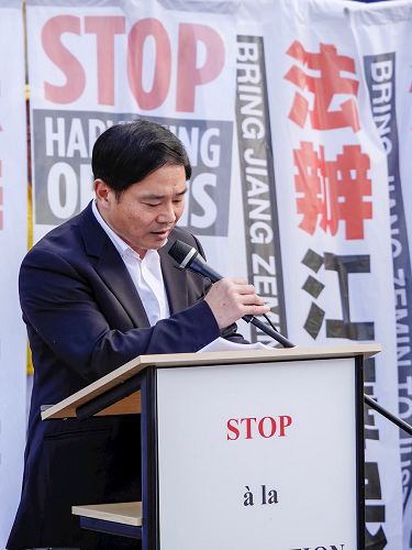 '图1:法国法轮大法学会会长唐汉龙先生在集会上发言'