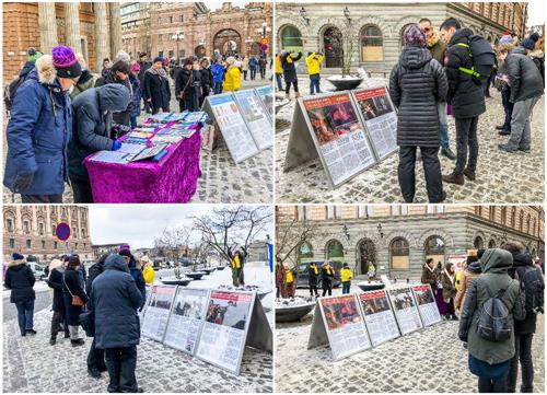 '图2:人们站在真相展板前仔细阅读,有的拿出手机拍学员祥和的炼功场面。'