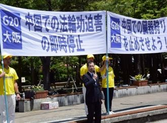 '图13:声援学员们的川上先生'