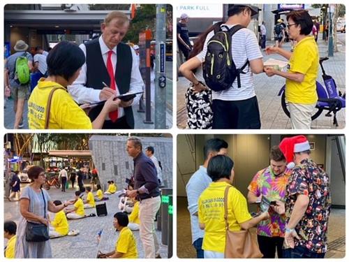 '图1~5:二零二一年十二月十日,在全世界纪念国际人权日之际,法轮功学员在昆士兰布里斯班市中心的乔治国王广场(King George Square)举办了讲真相活动'