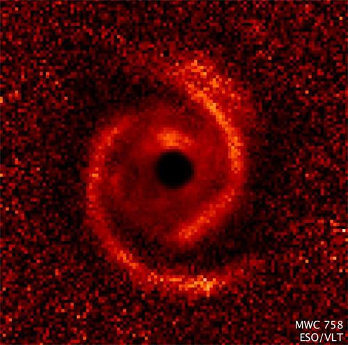 '婴儿“太阳系”MWC 758(Image credit:NASA / ESA / ESO / M. Benisty et al )'